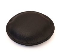 Circular leather paperweight